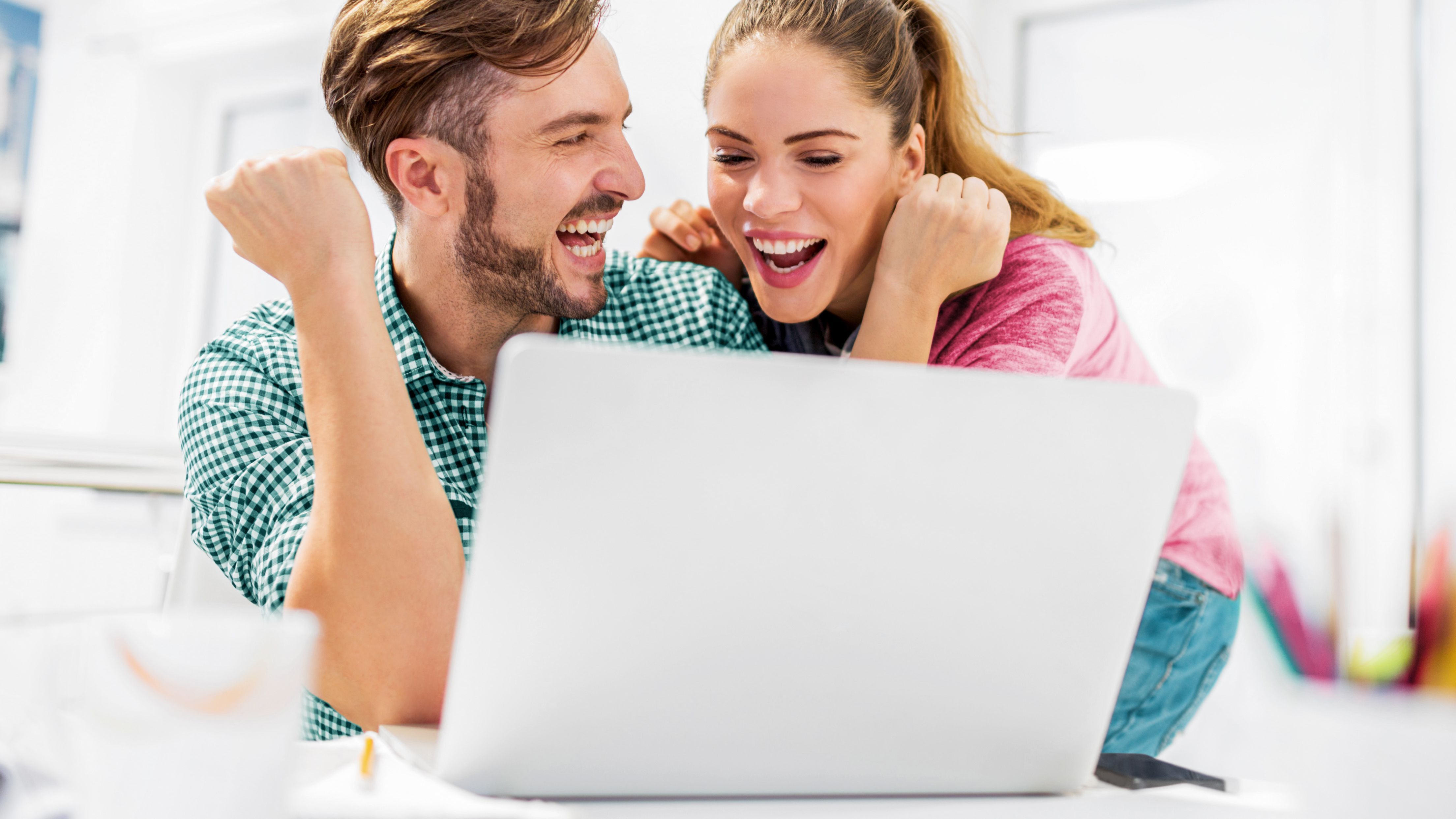 Woman and man successfully create a website with WordPress