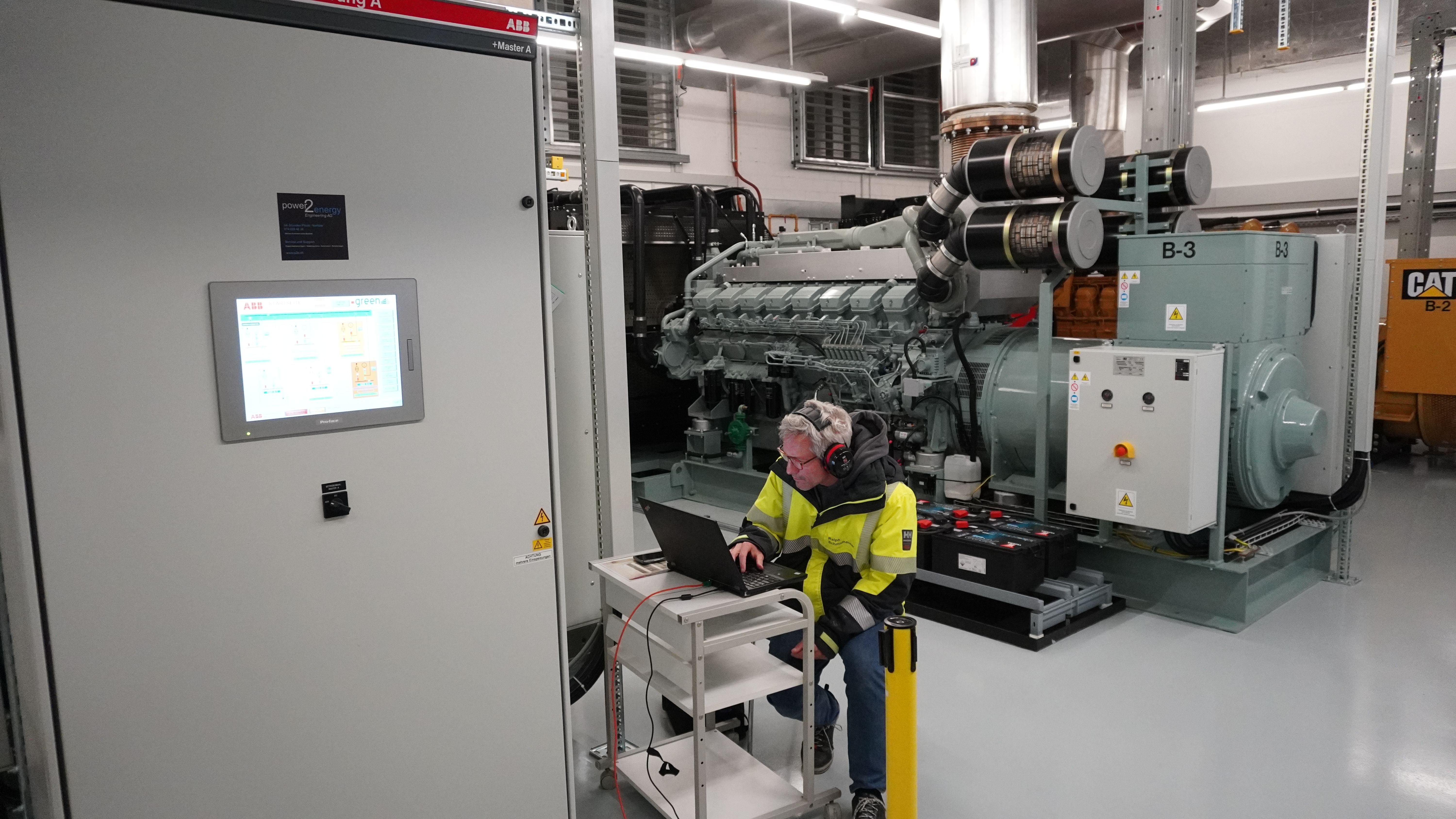 Employee is controlling the machine on the monitor