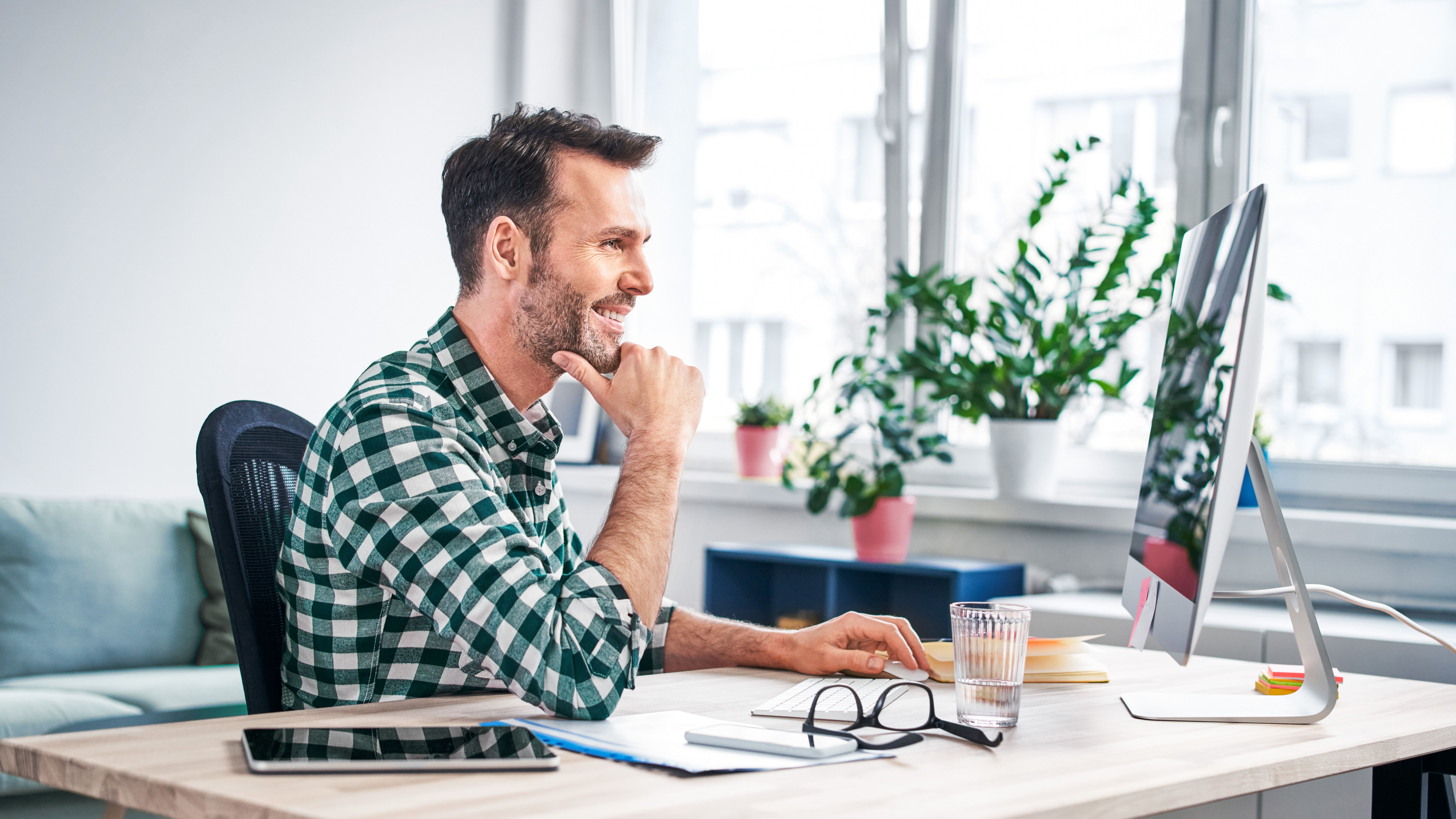 Man in an office at his computer