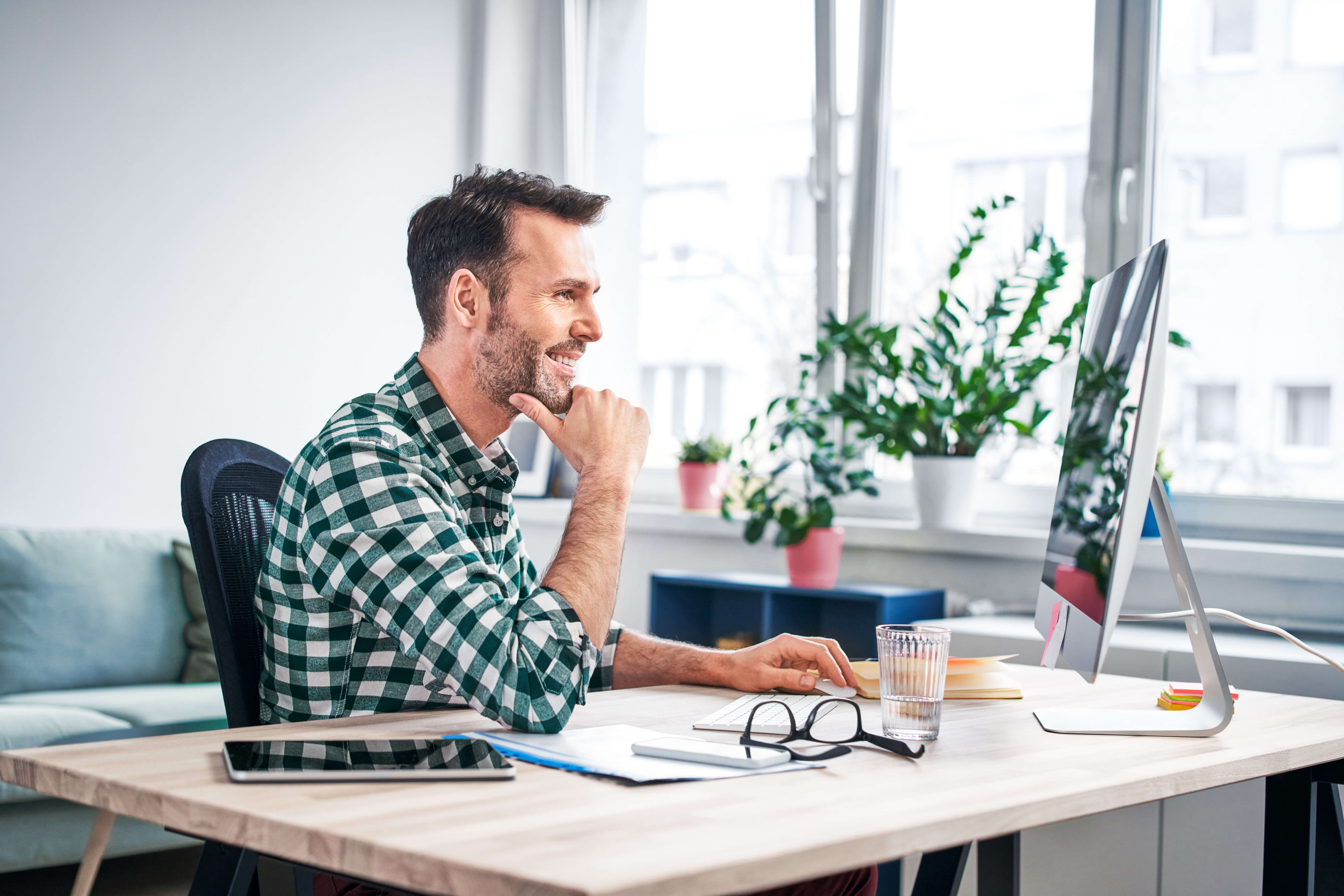 Man in an office at his computer