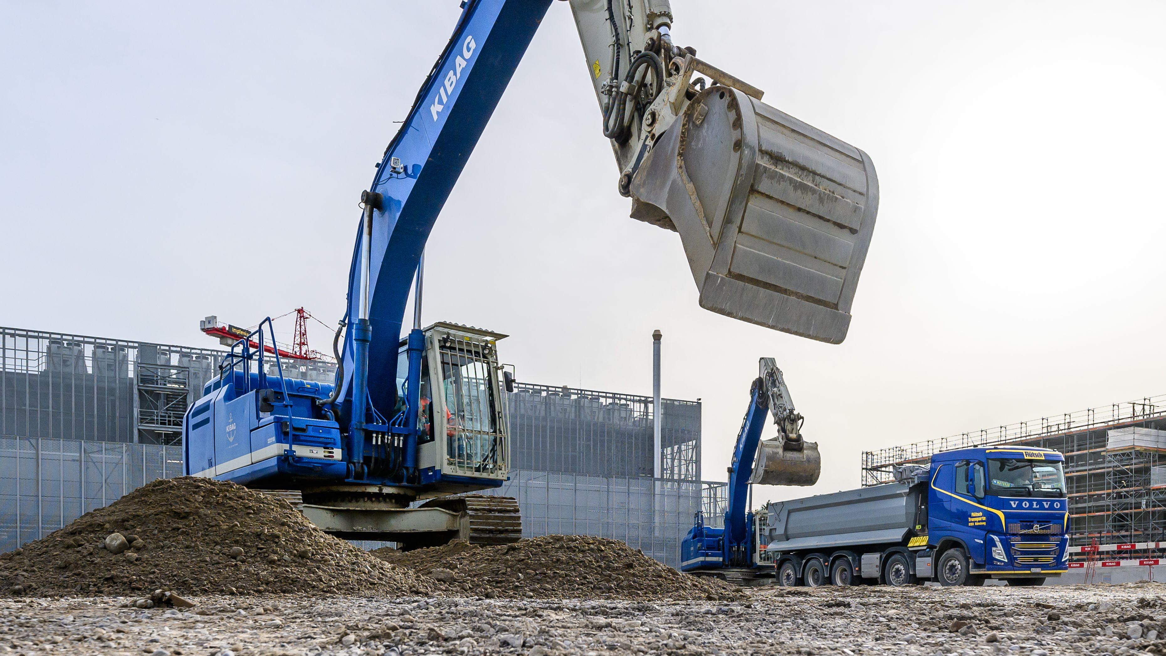 Construction site with blue excavator