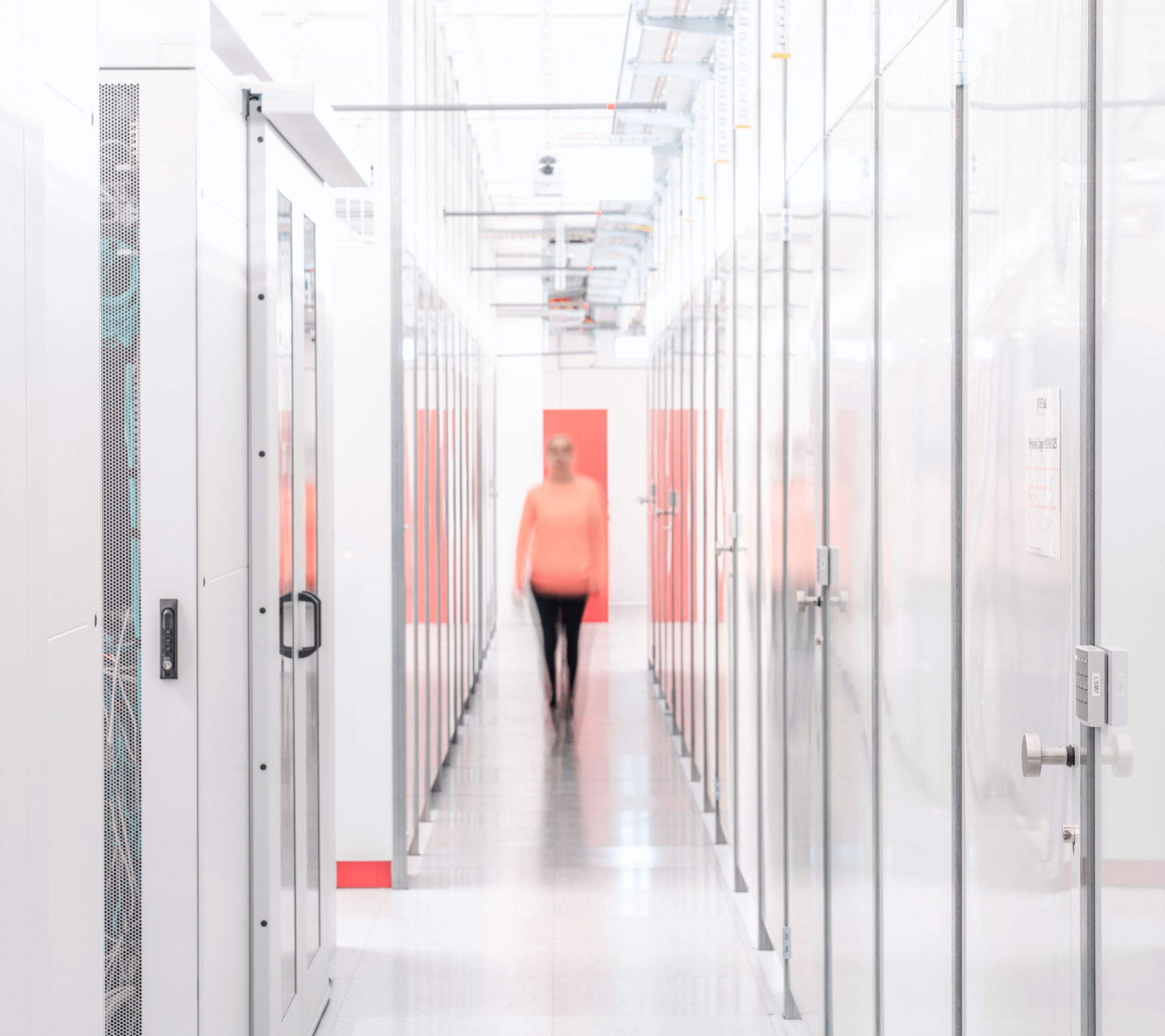Datacenter Cage hallway with woman
